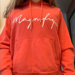 A light red almost orangish hoodie